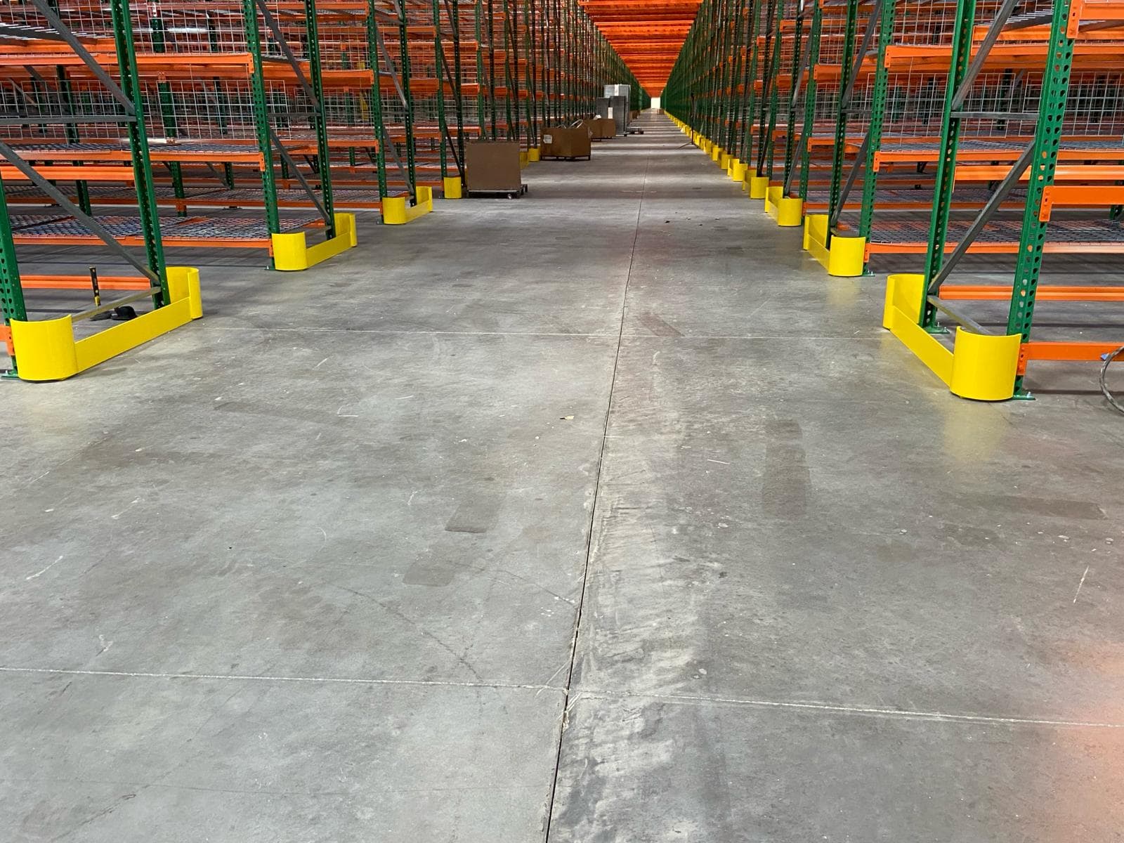 Warehouse aisle with column protectors and completed rack installation